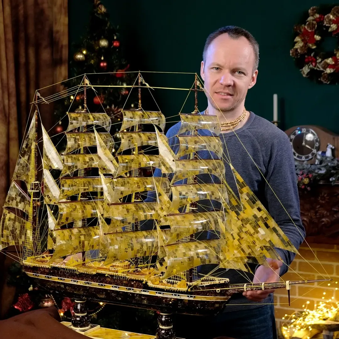 Master craftsman with an amber ship